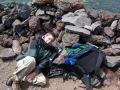 Hunter at the summit - hunkered down in the bunker against the wind.jpg